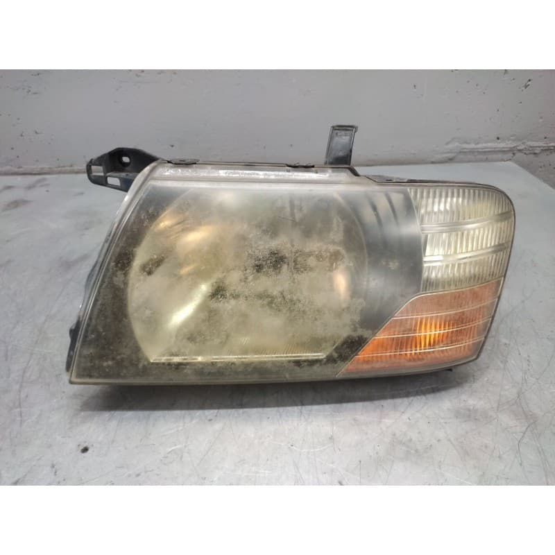 Recambio de faro izquierdo para mitsubishi pajero referencia OEM IAM - Azul