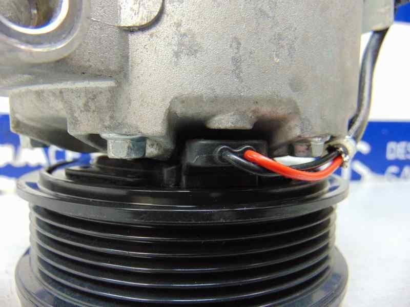 Compresor aire acondicionado, DV61-19D629-F2A usado 5