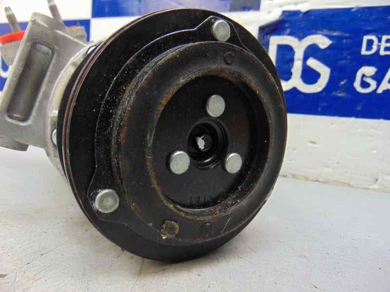 Compresor aire acondicionado, DV61-19D629-F2A usado 7