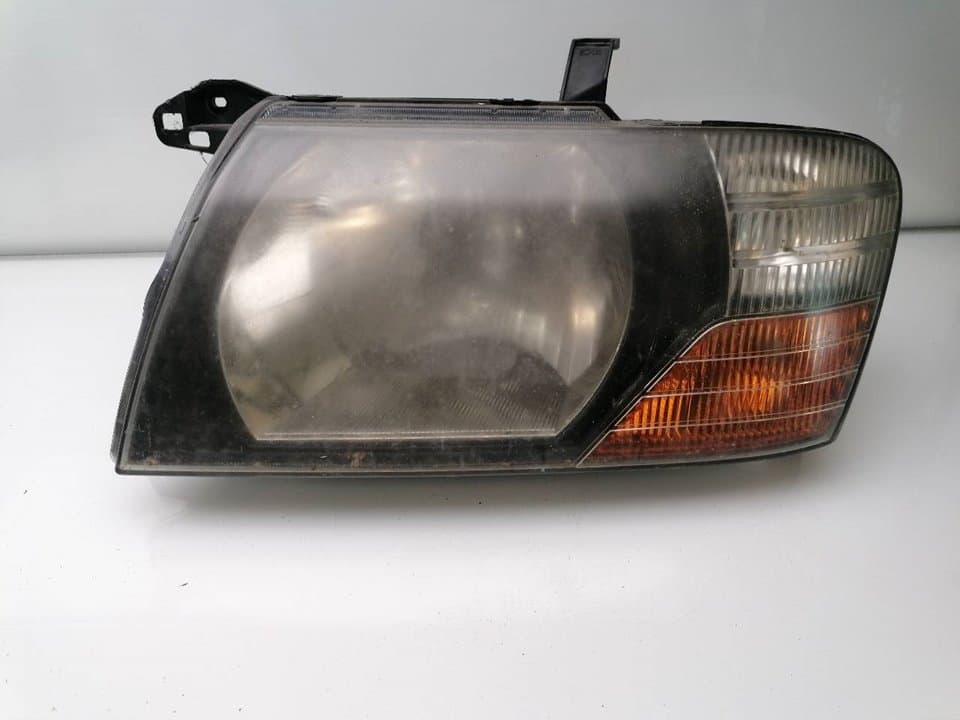 Faro izquierdo MITSUBISHI MONTERO (V60/V70)