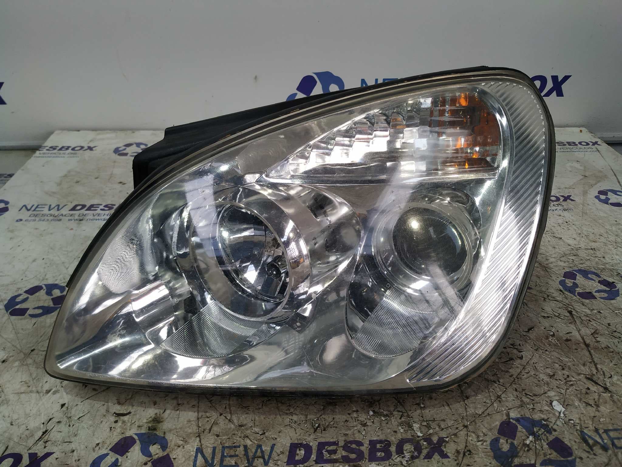 Recambio de FARO IZQUIERDO para KIA CARENS D4EA referencia OEM IAM 921011D0 - NEGRO